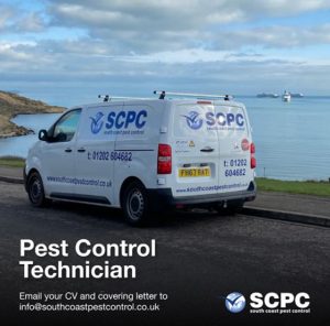 Pest control technician driving to a job.